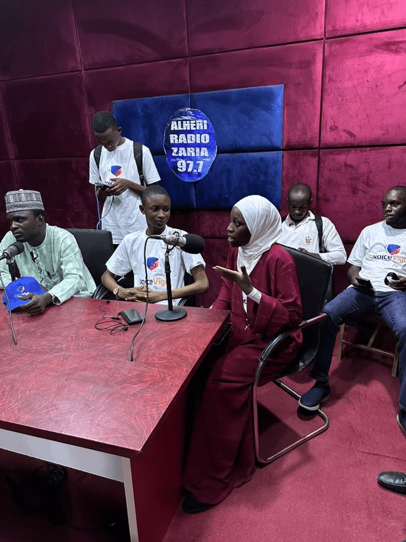 Language Champion speaking at a radio broadcast